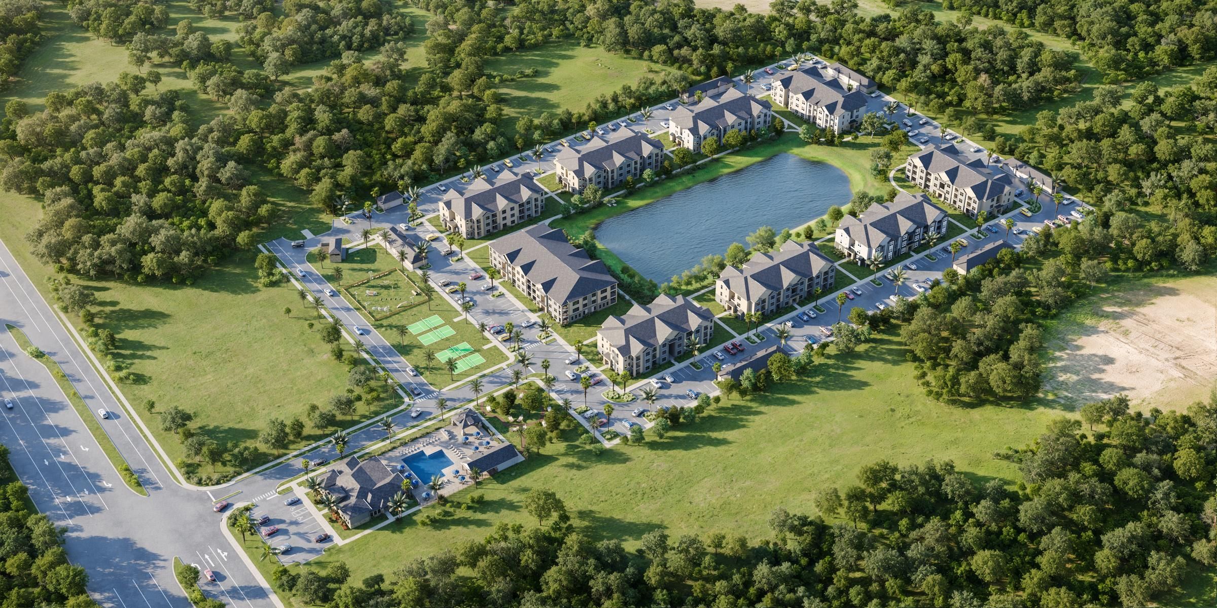 Evolve Grove Park Aerial view of a residential development nestled among lush green trees in a serene woodland setting.